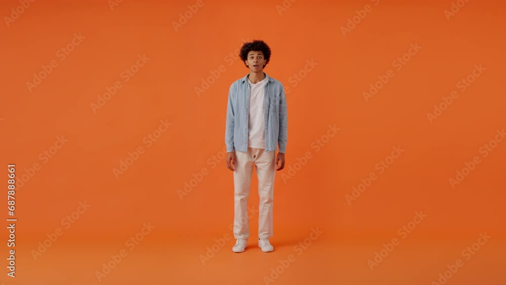 Gentleman waving hand and making hello gesture in studio Gentleman waving hand and making hello gesture in studio