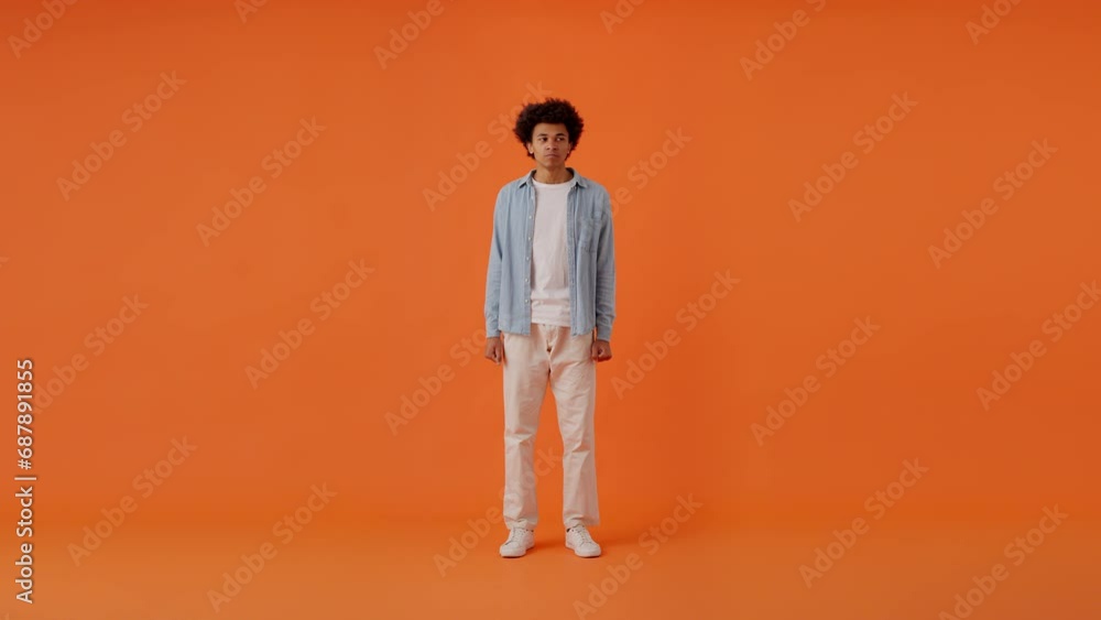 Emotional man in bad mood showing anger with hands and face Emotional man in bad mood showing anger with hands and face