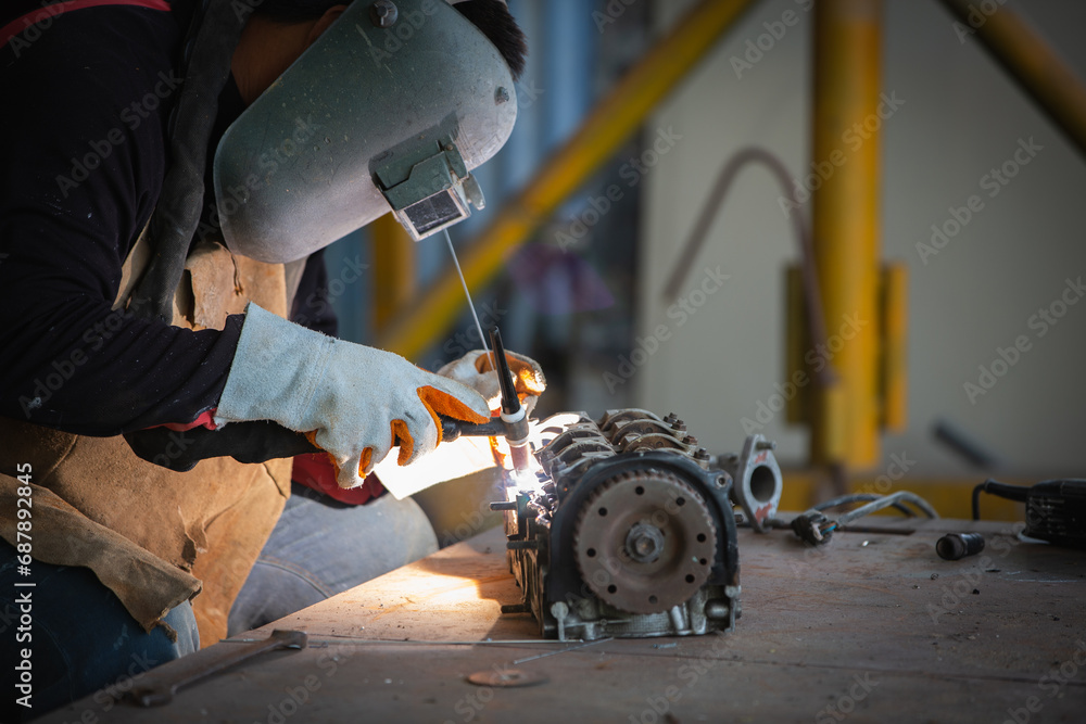 Welder is welding Tungsten Inert Gas welding, Welding aluminum with