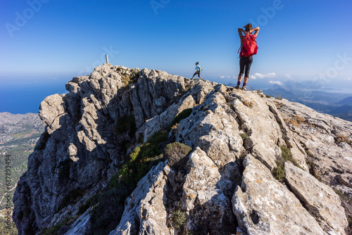 hikers on the summit ridge of Puig Tomir, Escorca, Majorca, Balearic Islands, Spain