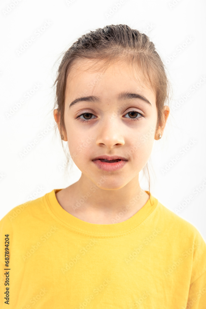 Portrait of girl in yellow t-shirt, isolated on white background. Portrait of girl in yellow t-shirt, isolated on white background.