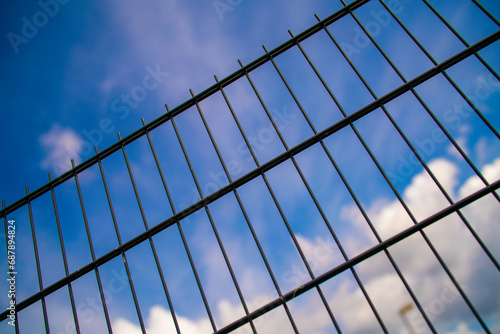 Metal Fence with Blue Sky