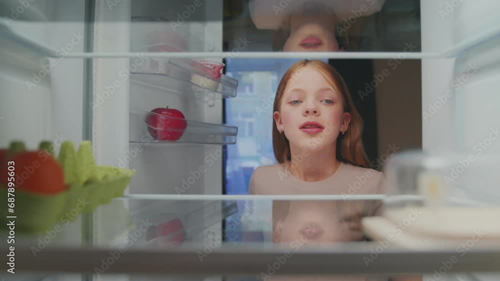 Young Girl Opening Fridge Door and Looking at Empty Shelves. Kid Feeling Hungry and Selecting Healthy Food and Products to Shop. Pretty Child Choosing Grocery Ingredients of Refrigerator to Cook Meal Young Girl Opening Fridge Door and Looking at Empty Shelves. Kid Feeling Hungry and Selecting Healthy Food and Products to Shop. Pretty Child Choosing Grocery Ingredients of Refrigerator to Cook Meal