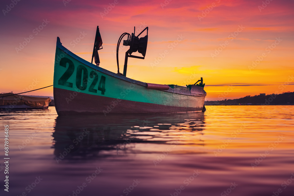 2024 Fishing boat on beach shore and sunset reflection in water  - obrazy, fototapety, plakaty 