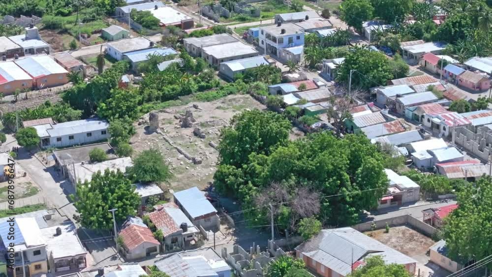 La Merced Convent Ruins Surrounded By Residential Houses In Pueblo Viejo, Azua, Dominican Republic. - aerial shot La Merced Convent Ruins Surrounded By Residential Houses In Pueblo Viejo, Azua, Dominican Republic. - aerial shot
