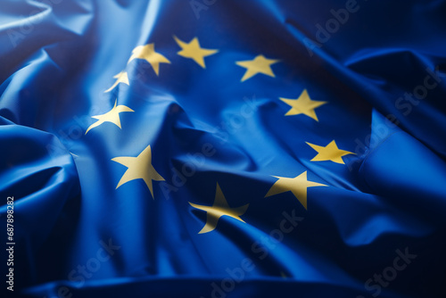 Closeup of the European Union flag fluttering in the wind. fabric texture design. Generative AI photo