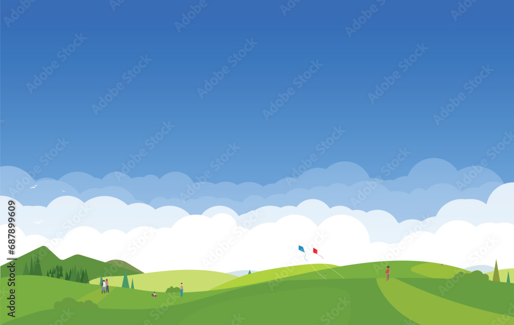 Meadow in mountains. People resting and playing on hills. Trees and green grass on the hills. Kids playing with kites. Blue sky and white clouds high in mountains.