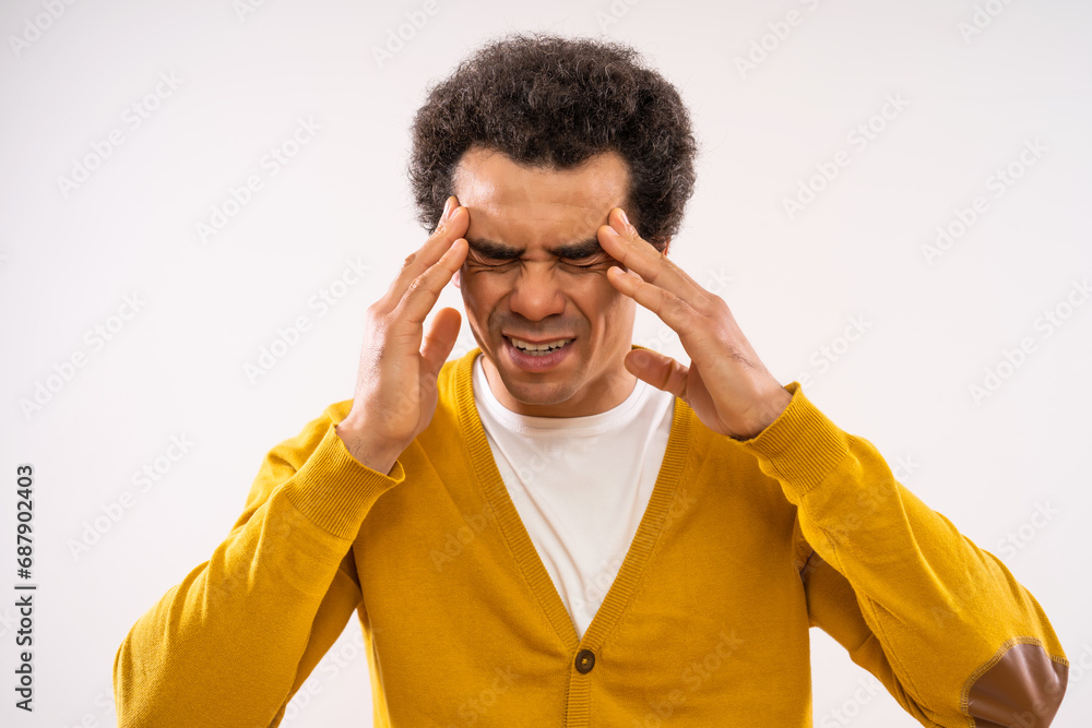 Studio shot portrait of multiracial man who is having headache. Studio shot portrait of multiracial man who is having headache.