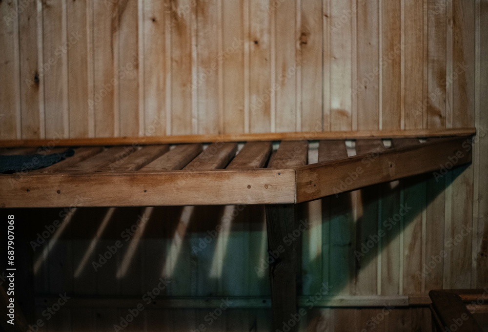 Wooden bath, sauna interior. Wooden lounger in the bathhouse. Wooden bath, sauna interior. Wooden lounger in the bathhouse.