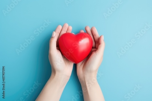 Hands Hold Heart On Blue Background Highquality Photo
