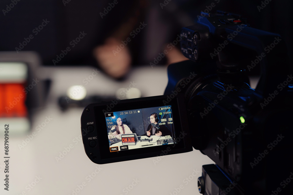 This image offers a behindthescenes glimpse of a professional podcast