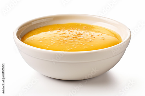 a bowl of soup with a spoon in it
