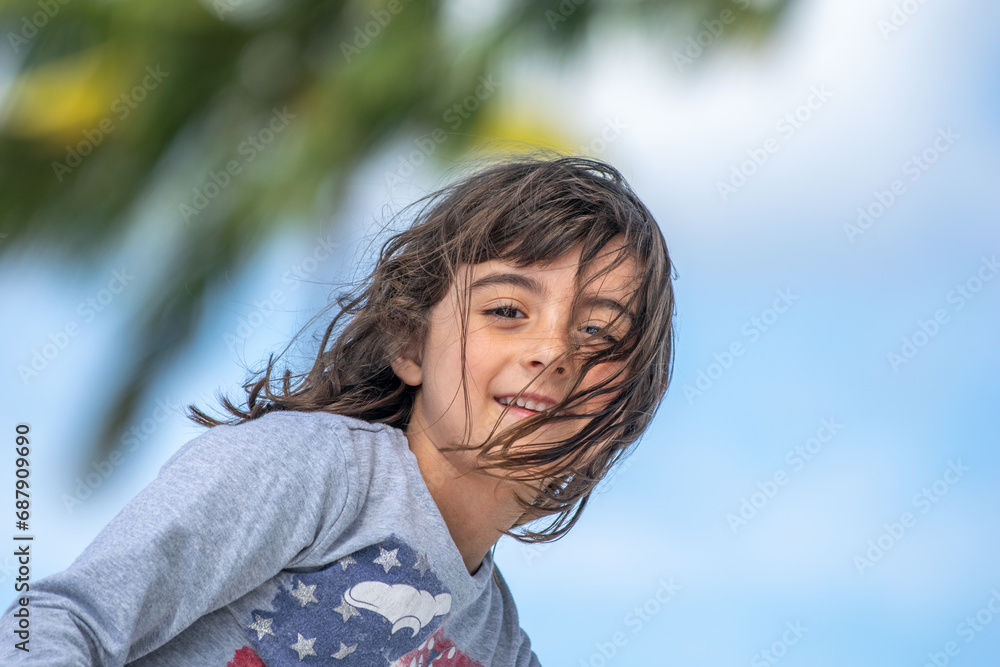 Happy young girl wearing american flag shirt