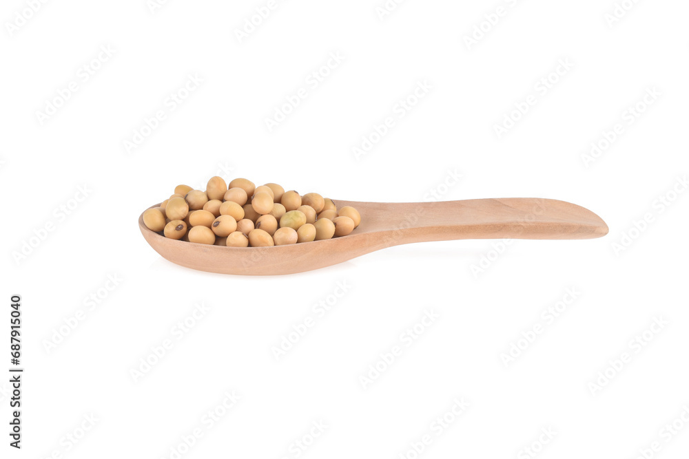 Soybean seeds in wooden spoon isolated on white background Soybean seeds in wooden spoon isolated on white background