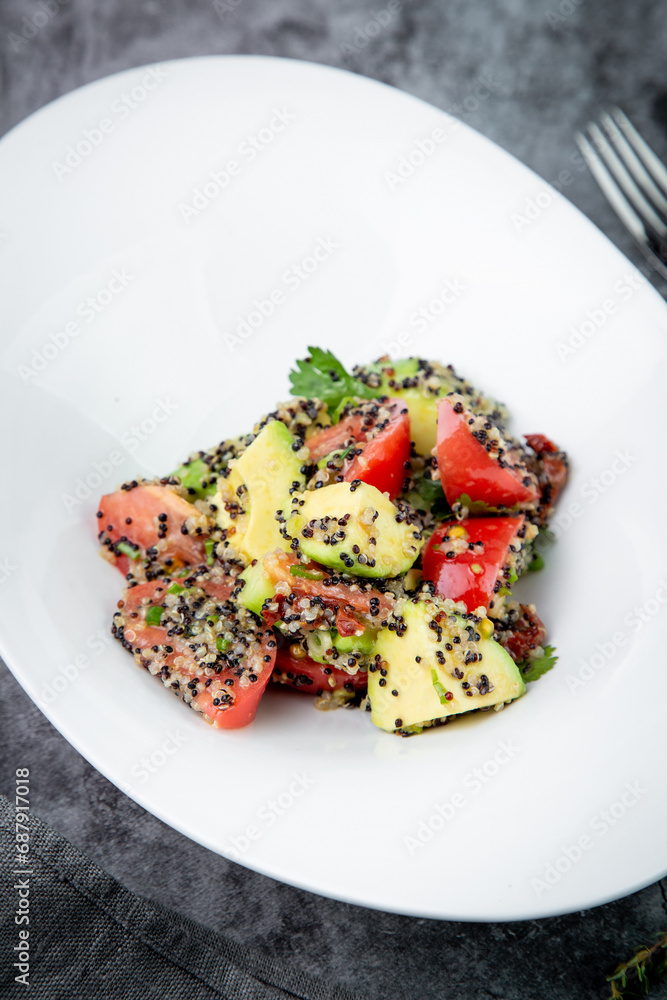 salad of tomatoes, zucchini, grated garlic with a lot of sesame seeds, top view salad of tomatoes, zucchini, grated garlic with a lot of sesame seeds, top view