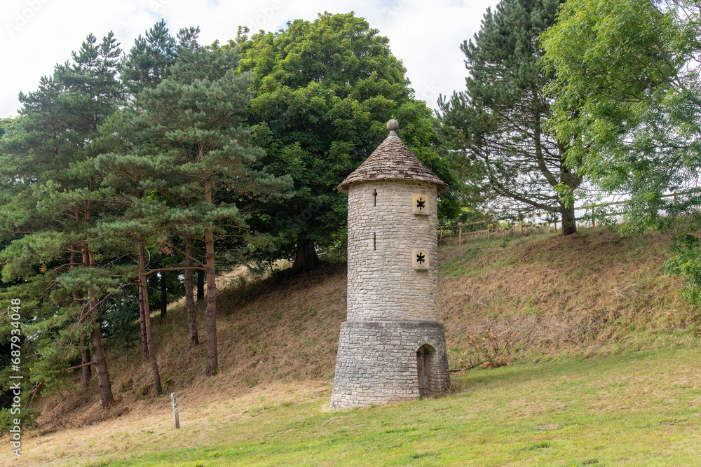 View of a brick bird tower or wildlife tower that provides a nesting place for swallows and barn owls near Horton, Bristol, UK along the public footpath of Cotswold Way