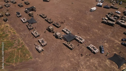 A field full of Israeli armour on the border ready for the Gaza ground offensive  photo