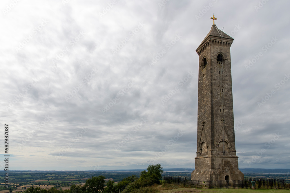 Low angle view of Tyndale Monument at North Nibley, Gloucestershire, UK, built in honor of William Tyndale overlooking the Cotswold Edge with footpath Cotswold Way passing the monument