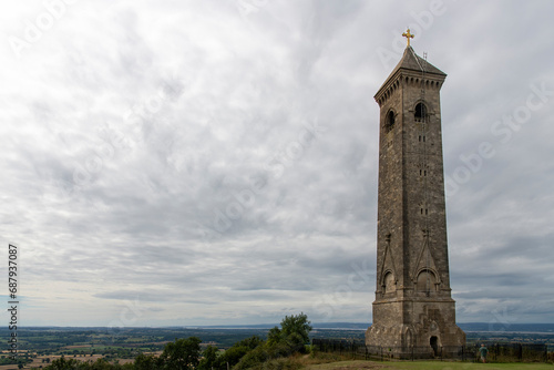 Low angle view of Tyndale Monument at North Nibley, Gloucestershire, UK, built in honor of William Tyndale overlooking the Cotswold Edge with footpath Cotswold Way passing the monument © Sonja