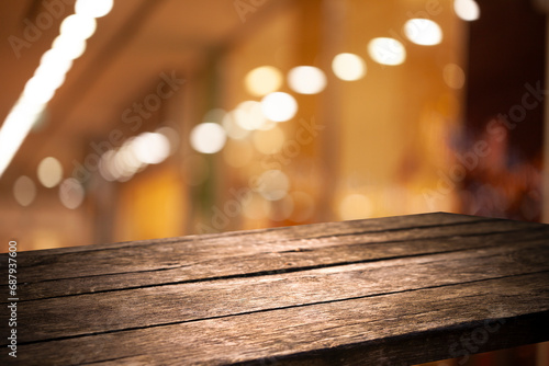 Perspective empty wooden table from above on blurred bokeh background can be used mockup to display installation products or design mockup.