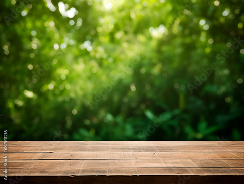 Empty wooden table with green background