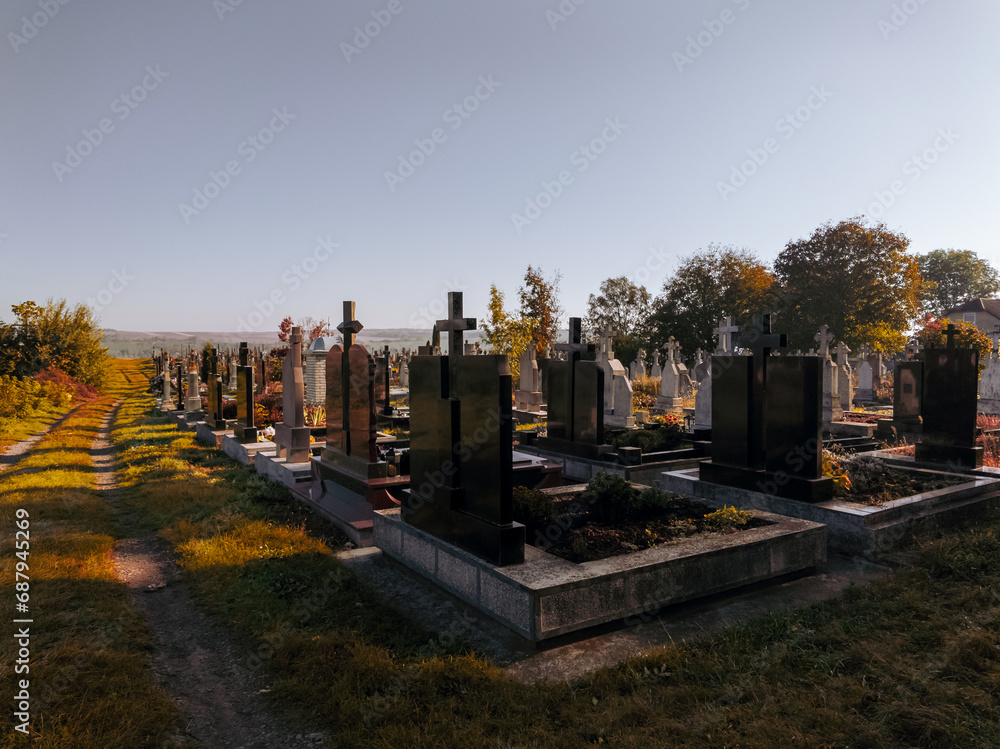 Modern cemetery with graves and crosses in a sunny morning. Modern cemetery with graves and crosses in a sunny morning.