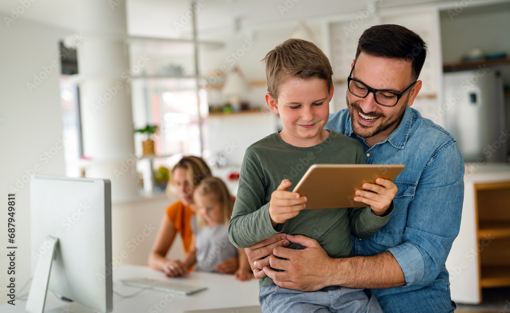 Father and child using digital tablet for e-learning. Education home digital device kid concept.