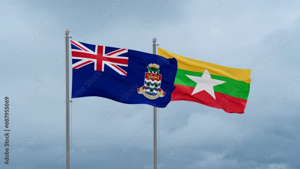 Myanmar aka Burma flag and Cayman Islands flag waving together on cloudy sky, endless seamless loop, two country relations concept Myanmar aka Burma flag and Cayman Islands flag waving together on cloudy sky, endless seamless loop, two country relations concept