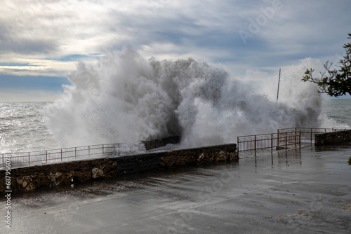 Rough sea with big waves on the piers of the Genoa seafront, Italy
