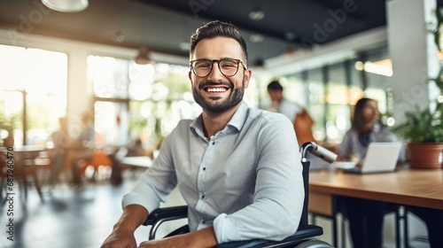 Businessman in a wheelchair in the office photo