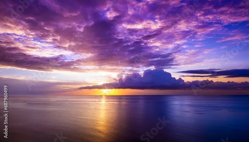 unreal violet purple sunset in the heavens above the sea © Nichole