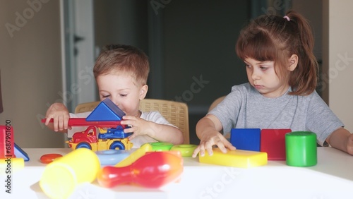 kindergarten. a group of children play toys cubes and cars on lifestyle the table in kindergarten. kid dream creative happy family preschool education concept. nursery baby toddler home