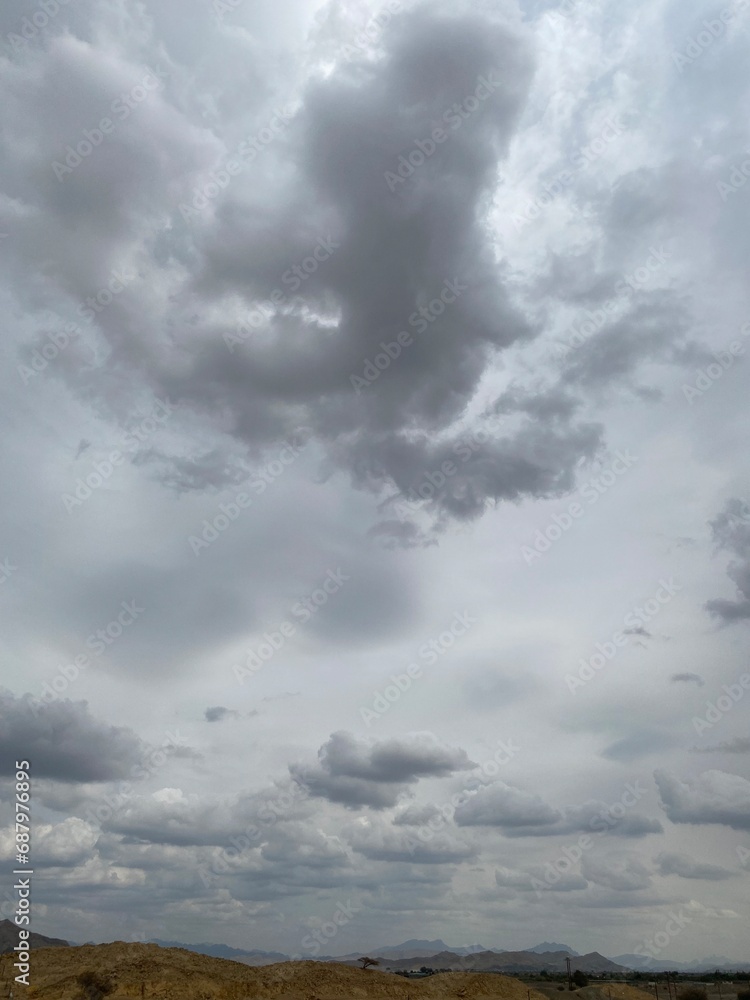 Blue and grey clouds in the overcast sky Blue and grey clouds in the overcast sky