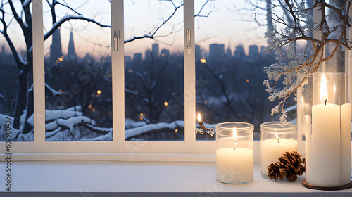 Winter wood table with window view of city and candle and branch with copy space, evening 