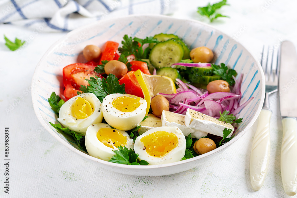 Breakfast. Greek salad and boiled eggs. Fresh vegetable salad with tomato, cucumbers, olives, arugula and cheese.