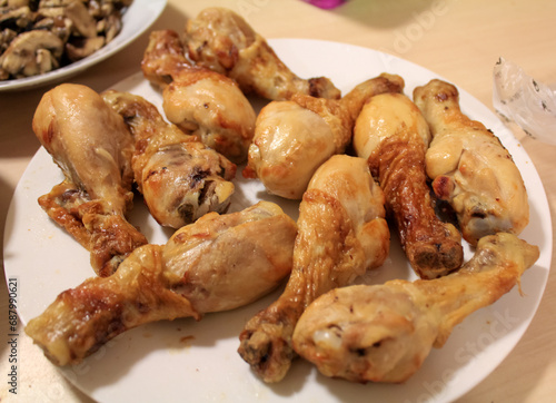 Close-up of the chicken drumsticks in the dish. Food Concept.