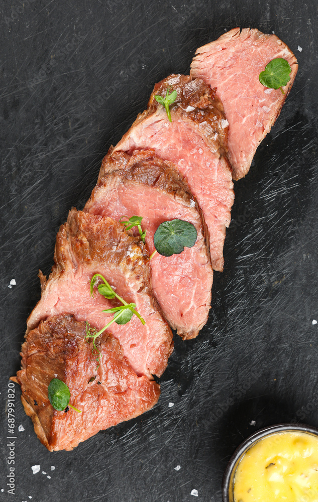 Beef tenderloin. Close up photo with a dish made of beef tenderloin