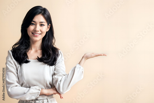 woman present by her left hand, copy space
