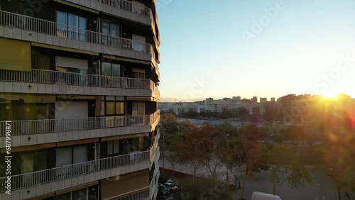 SUNRISE BARCELONA CITY, URBAN AREA, AEREAL, BRIDGE AND CARS, SUN AND BLUE SKY, REFLECTIONS AND EMOTIVE, MOVEMENT AND TRAVELLING BUILDING AND BUILDINGS, BALCONY AND HOUSE FLAT 4K HQ SLOWMOTION 60 FPS photo