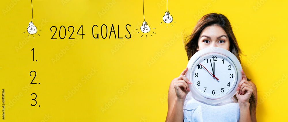 2024 goals with young woman holding a clock showing nearly 12 - obrazy, fototapety, plakaty 