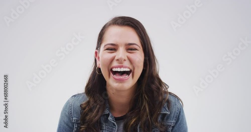 Woman, comedy and laugh in studio for humor, funny meme or carefree personality on mock up space. Person, lady and laughing with joke, confidence and positive expression on white background for fun photo
