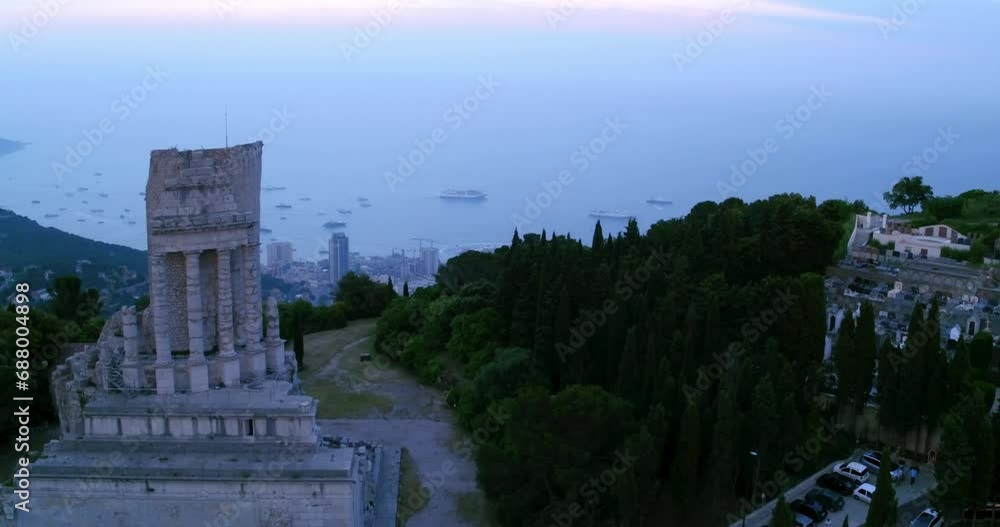 Aerial Forward Shot Of Trophy Of Augustus Monument On Mountain By Harbor In Sea - Monte Carlo, Monaco Aerial Forward Shot Of Trophy Of Augustus Monument On Mountain By Harbor In Sea - Monte Carlo, Monaco