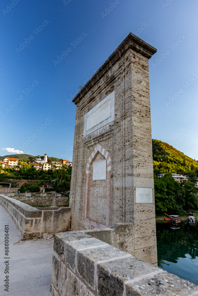 Memorial stone plate on the old bridge on Drina river near Andricgrad in Bosnia and Herzegovina Memorial stone plate on the old bridge on Drina river near Andricgrad in Bosnia and Herzegovina