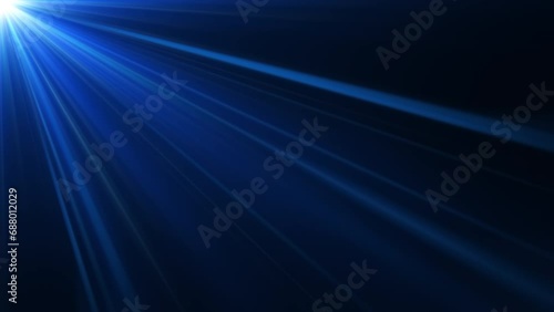 Loop top left blue optical lens flares shine rays light abstract background. 4K beautiful blue spotlight effects moving on top left. flash lights.Bright light lens flare photo