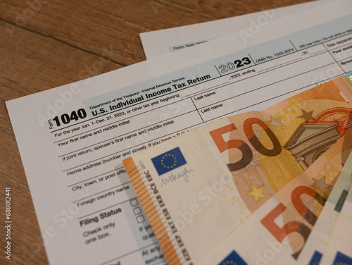 Tax deduction form and pen. Concept of paying taxes and filing tax return