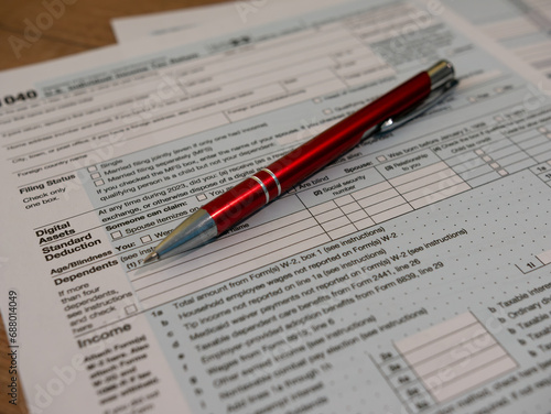 The pen is lies on the tax form 1040 U.S. Individual Income Tax Return. The time to pay taxes.