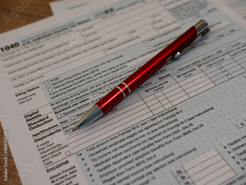 The pen is lies on the tax form 1040 U.S. Individual Income Tax Return. The time to pay taxes.