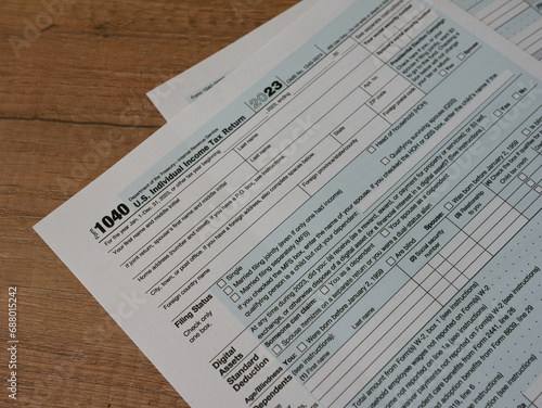 W-2 and 1040 Tax Form. Tax Payment Concept. Filing Taxes Document on Table in Office. Individual Income Tax Return
