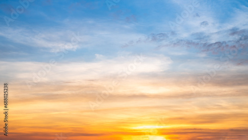 Beautiful luxury soft gradient with orange gold clouds and sunlight on the blue sky perfect for the background, take in everning,morning,Twilight, high definition landscape photo