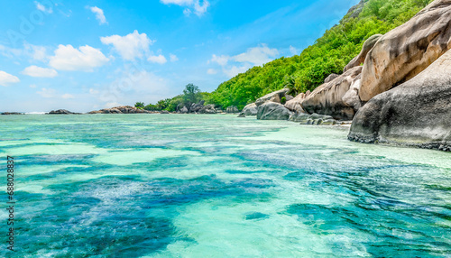 Granite rocks and coral reef in world famous Anse Source d'Argent beach photo